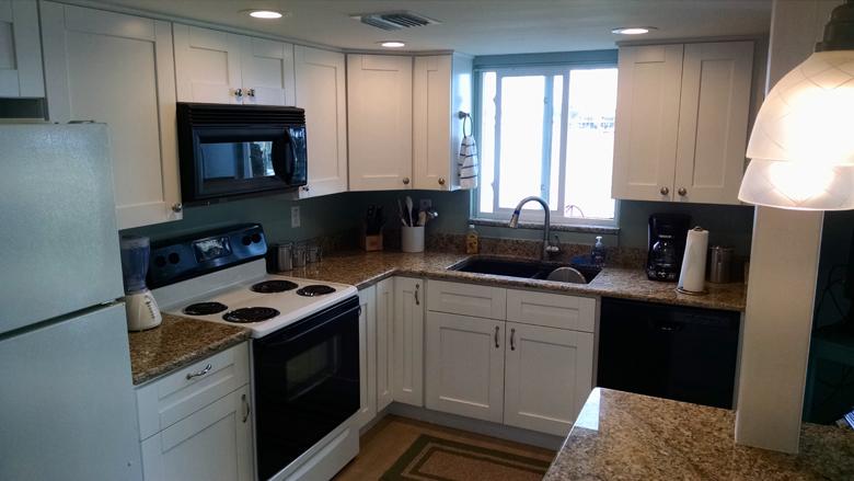 108 Kitchen w/ granite counter tops, dishwasher, microwave, and ice maker